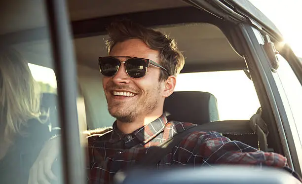 Shot of an affectionate young couple enjoying a roadtrip