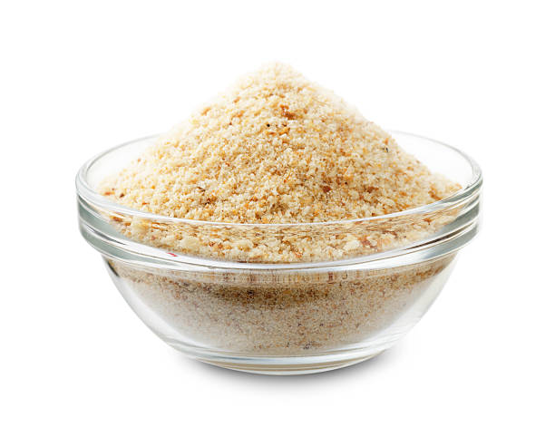 Bread crumbs in a glass bowl Bread crumbs in a glass bowl isolated on a white background breaded photos stock pictures, royalty-free photos & images