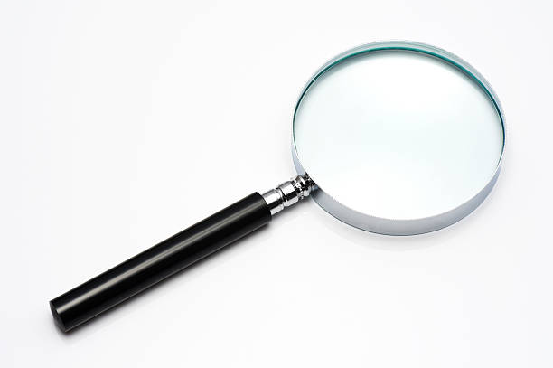 istock Magnifying glass up to the white background 621362670