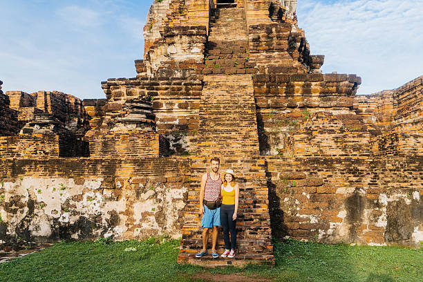 istock Couple near Buddhist Stupa 621362886
