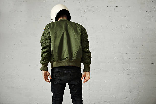 istock Man in a khaki pilot jacket with helmet 621364134