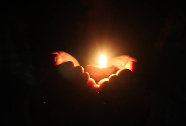 istock Hands Holding oil lamp 621365206