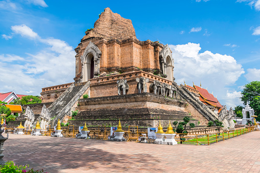 Chedi luang temple in chiangmai thailand with cloud blue sky in summer day