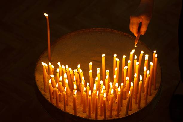 istock Burning candles with hand holding candle 621365926