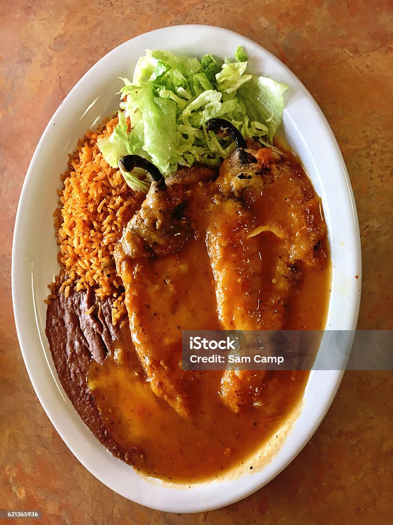 Chile stuffed dinner Order of two chile rellenos with rice and beans. Bean Stock Photo