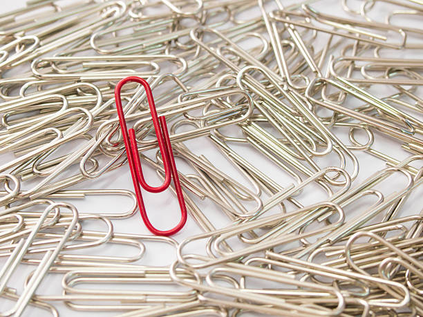 istock Red paper clip stand different from the crowd 621367908