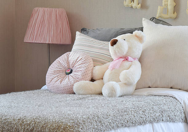 istock modern kids room with doll and pillows on bed 621368698