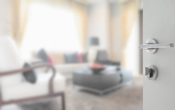 istock opened white door to modern living room interior 621369190
