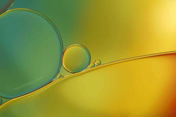 istock Oil drops on water surface - abstract coloreful macro (455) 621369406