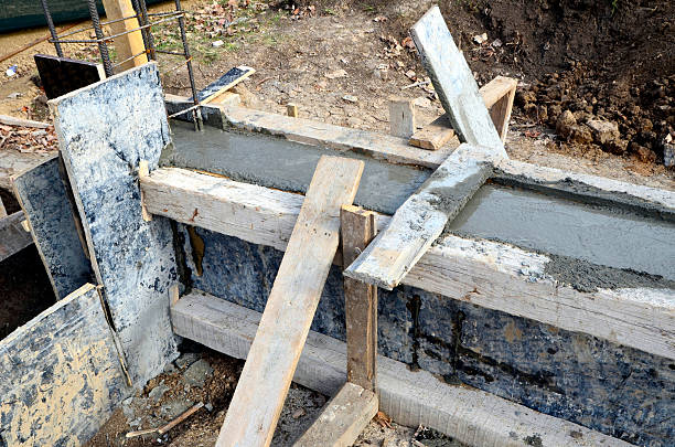 istock Fresh concrete in wooden concrete formwork 621370486