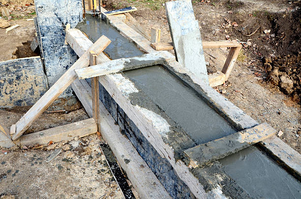 istock Fresh concrete in wooden concrete formwork 621370620