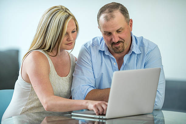istock Husband and Wife Planning Their Budget 621371212