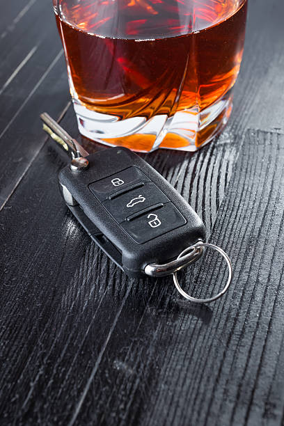 istock Car key and whiskey alcohol drink in a glass on 621371916
