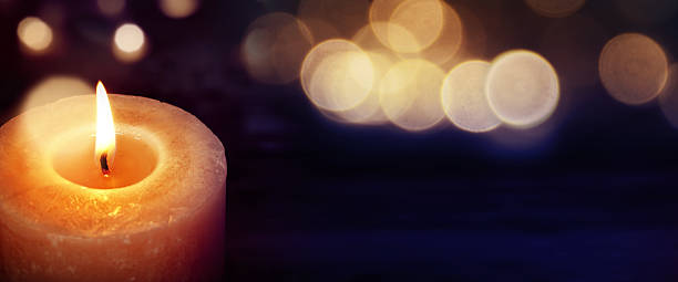 istock Candles with golden lights 621372018