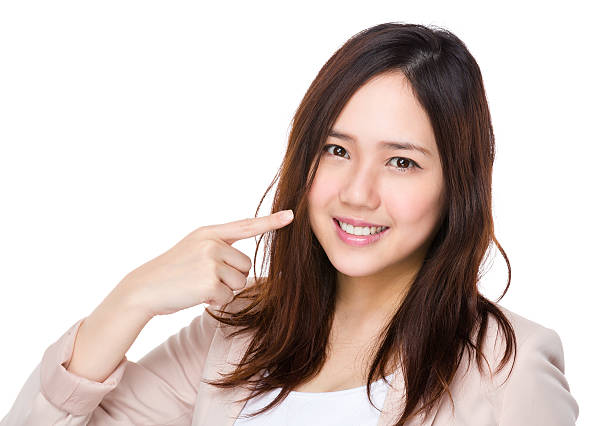 istock Businesswoman pointing at her teeth 621374236