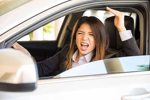istock Young woman with road rage 621374602
