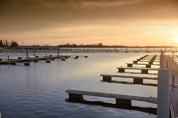 istock Yacht port over orange sunset 621375360