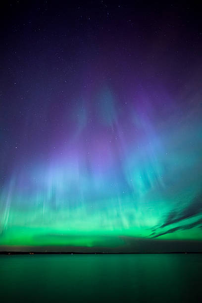 istock Northern lights over lake in finland 621375382