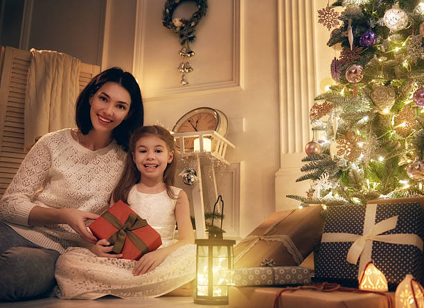 istock Mother and daughter exchanging gifts 621376392