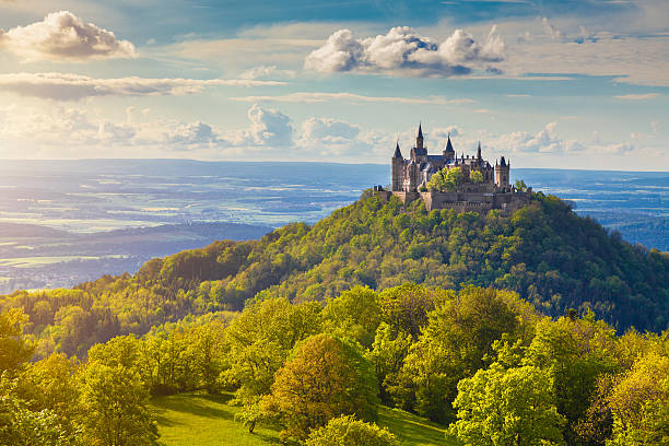 Hohenzollern Castle at sunset, Baden-Wurttemberg, Germany Hechingen, Germany - May 19, 2016: Aerial view of famous Hohenzollern Castle, ancestral seat of the imperial House of Hohenzollern and one of Europe's most visited castles, in beautiful golden evening light, Baden-Wurttemberg, Germany fort photos stock pictures, royalty-free photos & images
