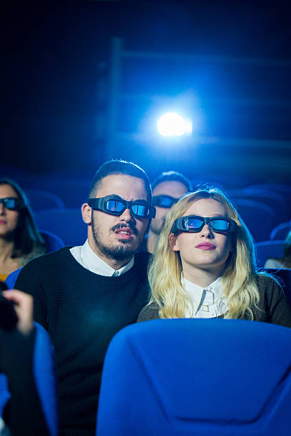 istock Beautiful couple at the cinema 621377836