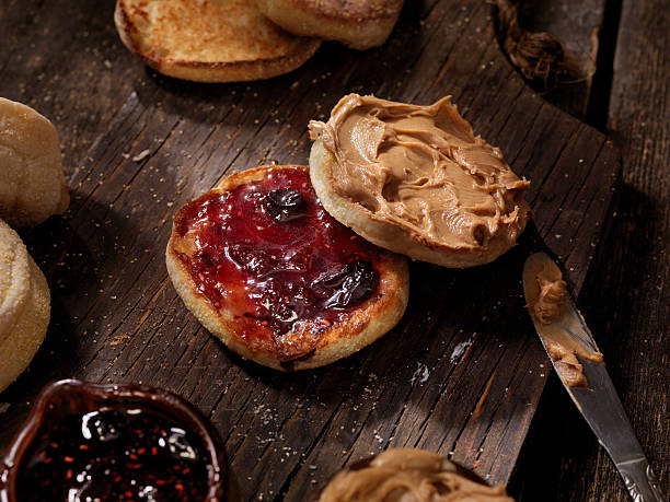 Toasted English Muffin with Peanut Butter and Jam Toasted English Muffin with Peanut Butter and Jam - Photographed on a Hasselblad H3D11-39 megapixel Camera System english muffin stock pictures, royalty-free photos & images