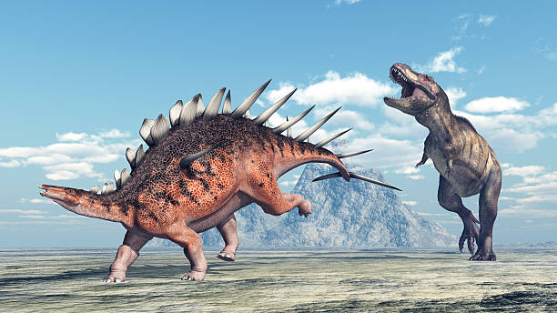 istock Tyrannosaurus Rex attacks Kentrosaurus 621379034