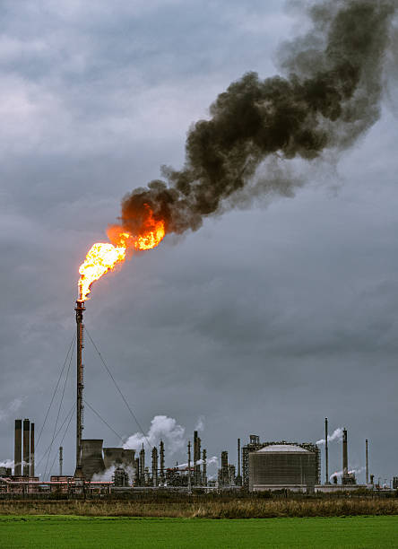istock Large petrochemical flare and smoke 621379724