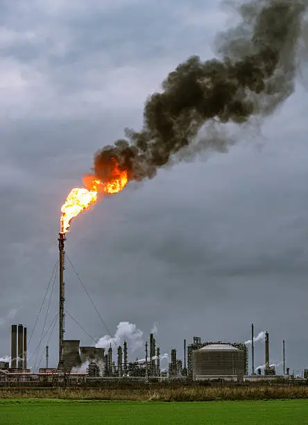 Photo of Large petrochemical flare and smoke