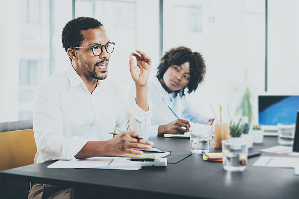 istock Black african project manager explaning business task in meeting room 621380206