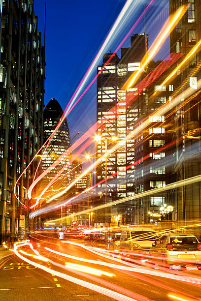 istock Busy London street with light trails at rush hour 621382032