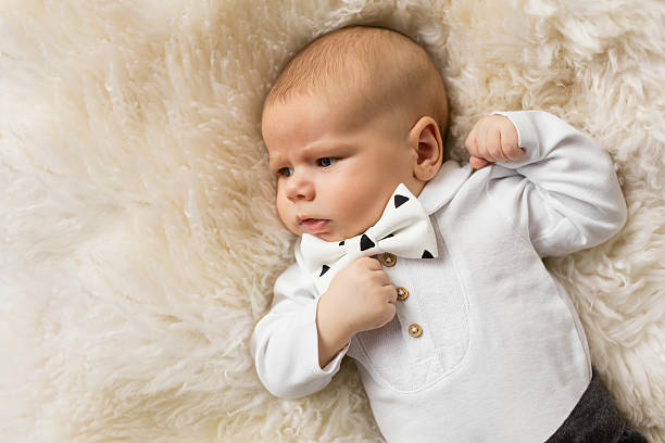 istock Little baby boy dressed up in suit with bowtie 621382242