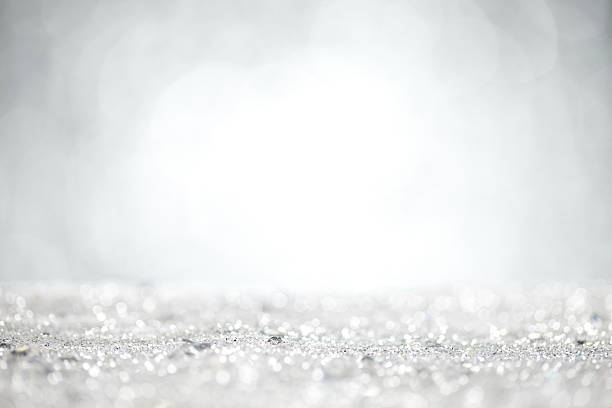 istock Close up of silver glitter with grey background 621383242