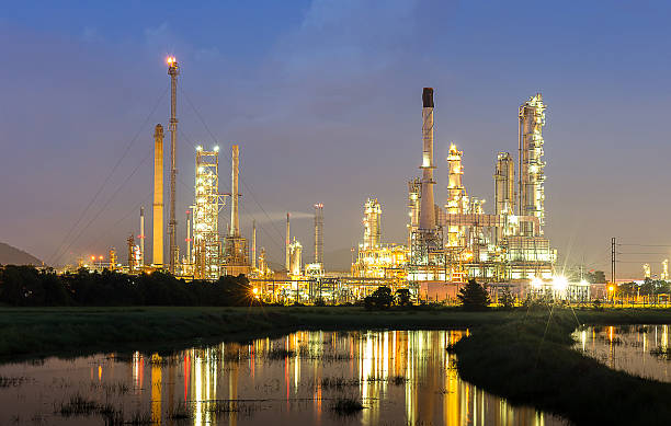 istock Oil refinery industry with twilight time 621383290