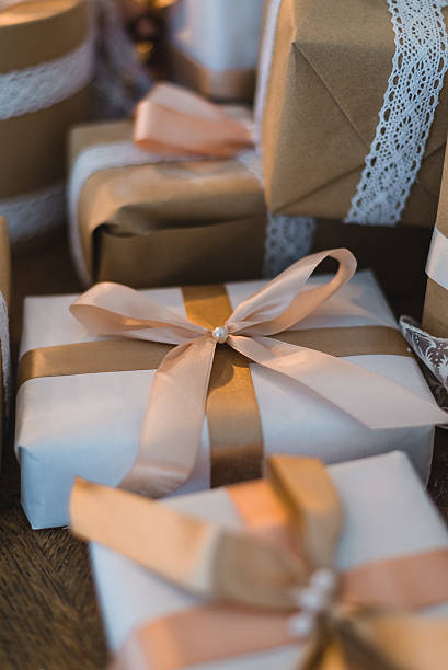 istock Classy Christmas hand made gifts box presents with brown bows 621384590