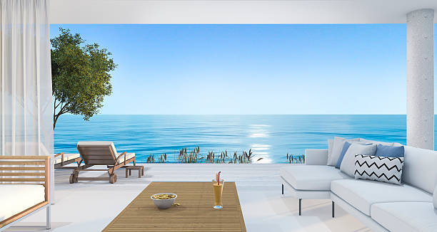 istock 3d rendering contemporary nice living room near beach 621384678