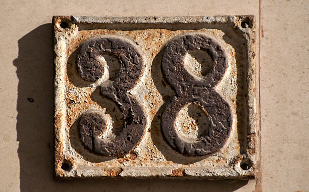 istock Old retro cast iron plate number 38 621385102