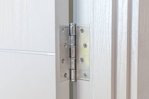 istock door hinges Aluminum on  white door 621385484