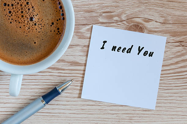 istock I need you written in notepad near morning cup of 621386992