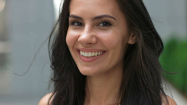 istock Beautiful lady smiling on camera. 621387418