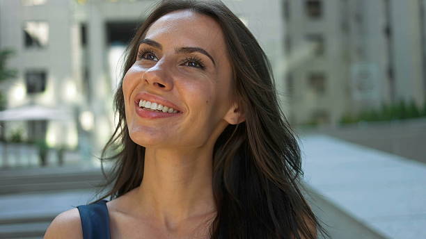 istock Adorable lady posing on camera in front of a business 621387628