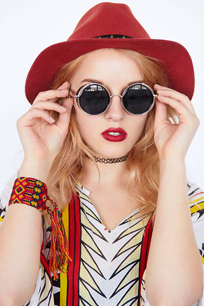 istock pretty girl with sunglasses and red hat 621388540