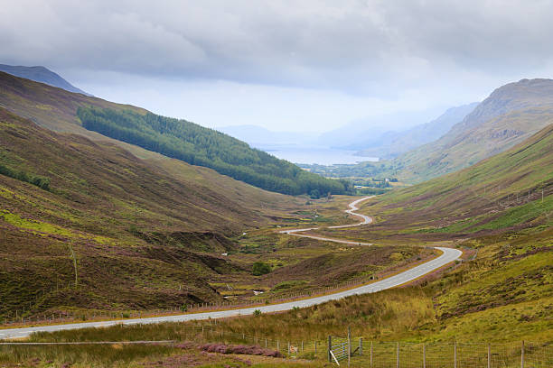 istock Scottish road trough countryside 621390264