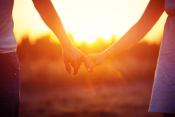 istock Man with woman to keep a hand on field 621391064