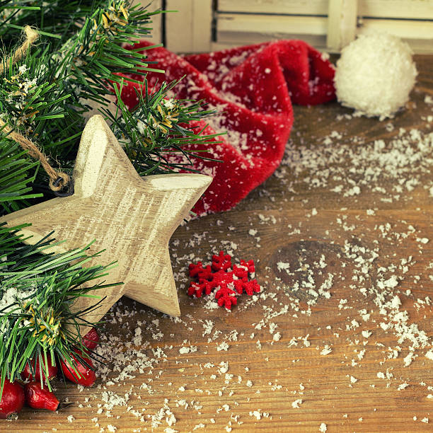 istock Christmas fir tree with red hat and snow 621392830