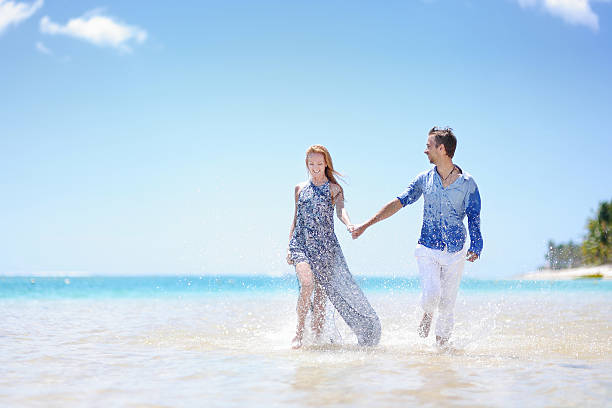 Young couple walking along the beach