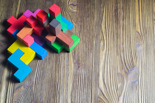 istock Abstract construction from wooden blocks game shapes. 621393290