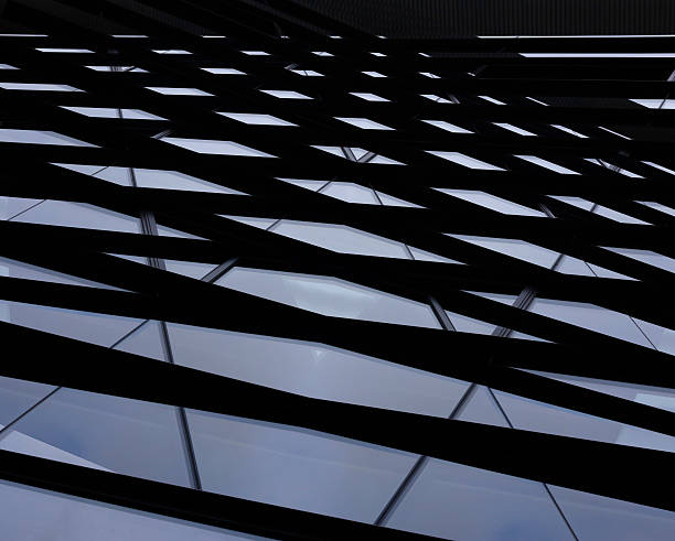 Double exposure photo of windows. Pyramid-shaped abstract architectural composition.