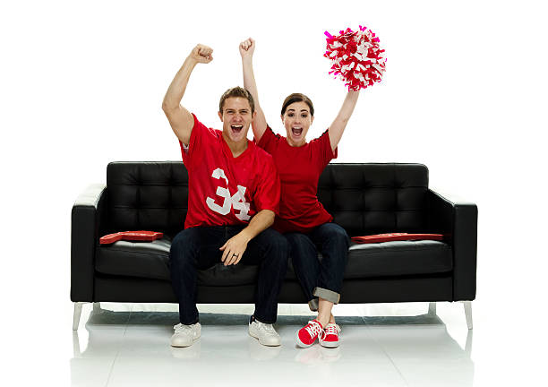 Cheerful football player cheering Cheerful football player cheering hand fan photos stock pictures, royalty-free photos & images
