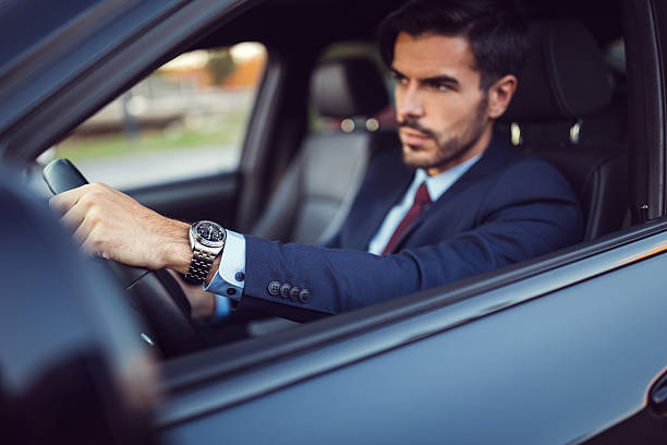 istock Businessman driving a car 621462140